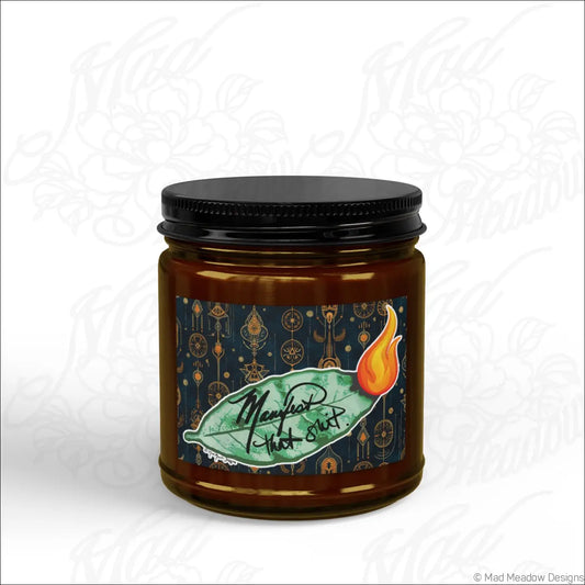Brown glass jar soy wax candle with black lid and green leaf flame label for manifest that sh!t burning bay leaf scent