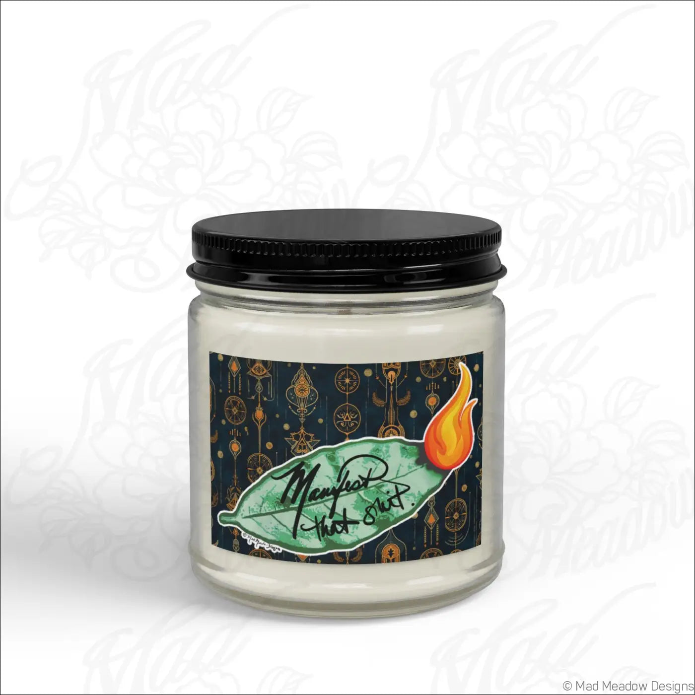 Manifest that sh!t burning bay leaf scented soy wax candle in a glass jar with black lid and mystical leaf label