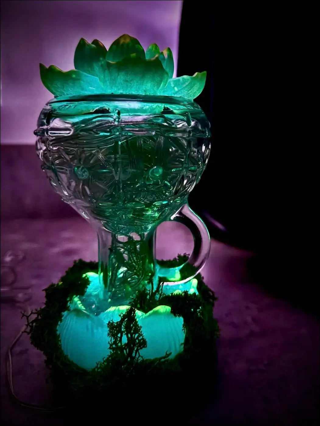 Mint green vintage glass lotus flower lantern with intricate cut patterns glowing softly with usb light