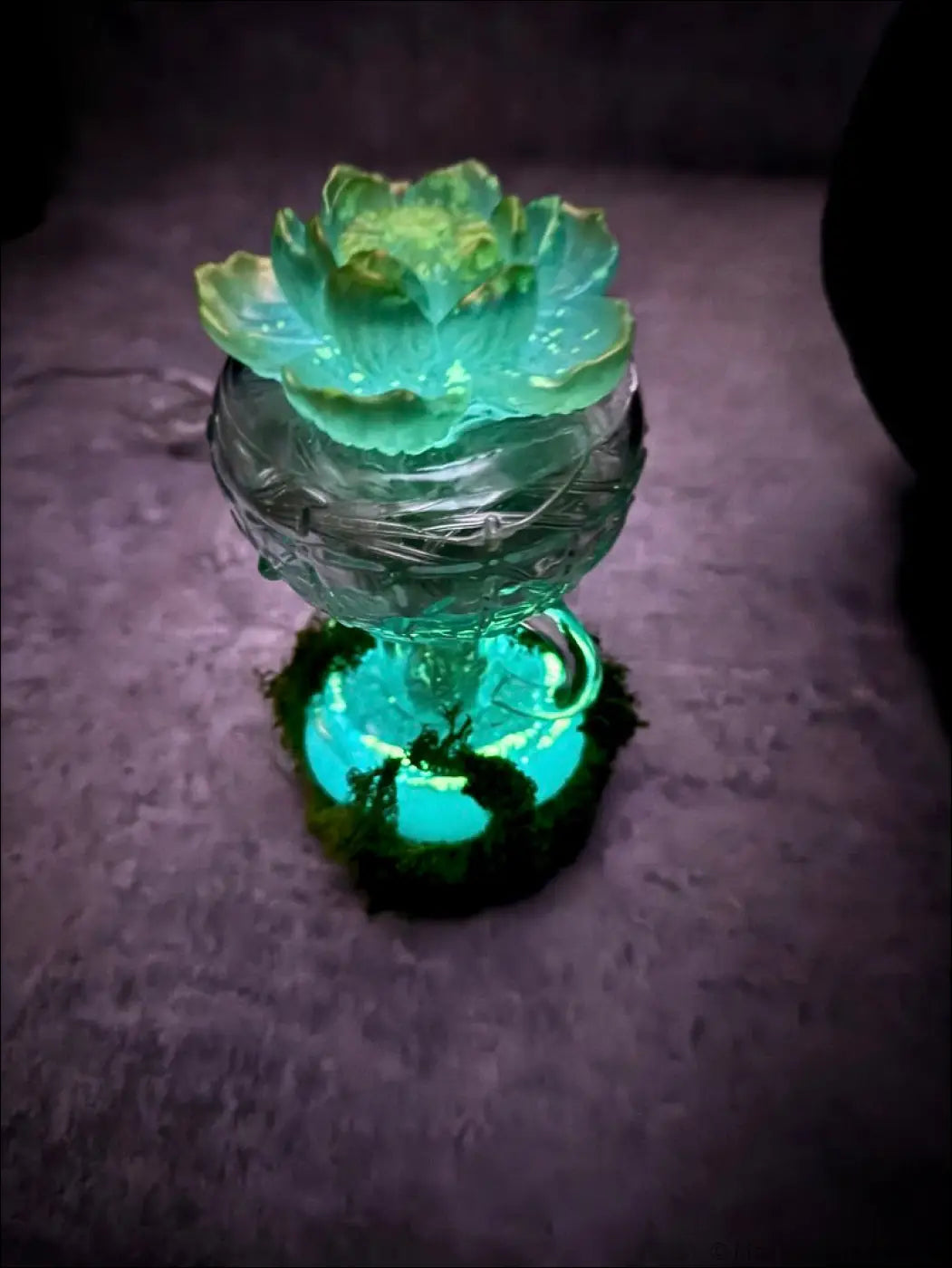 A mint green vintage glass lantern with a gold lotus design glowing softly as a usb lamp decor piece