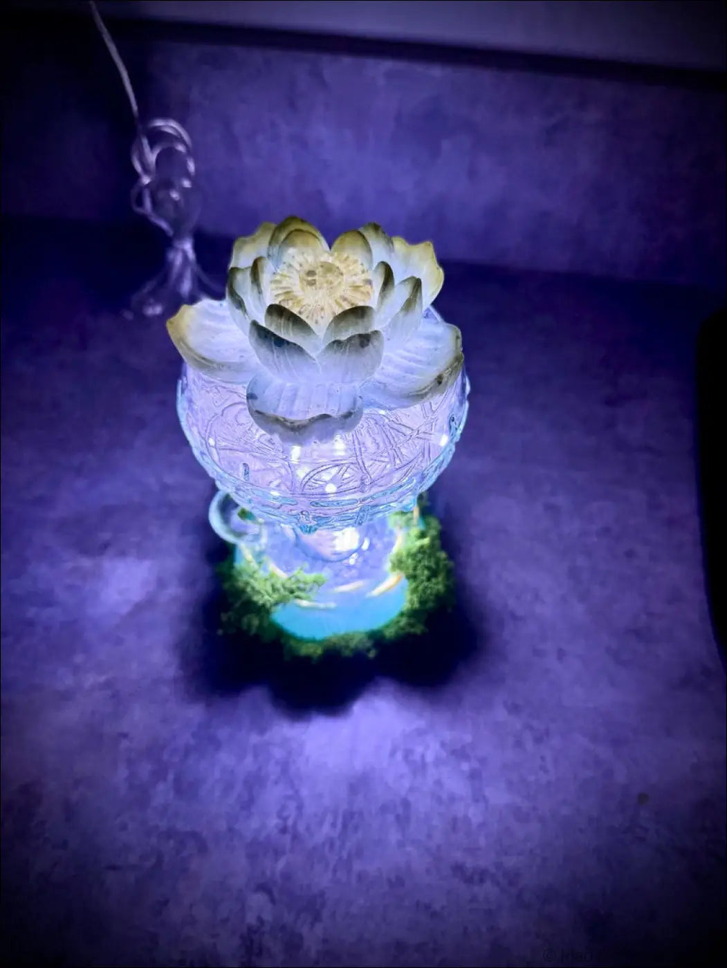 Mint green and gold lotus led lamp glowing softly with vintage glass bottle, moss, and white lights usb lamp