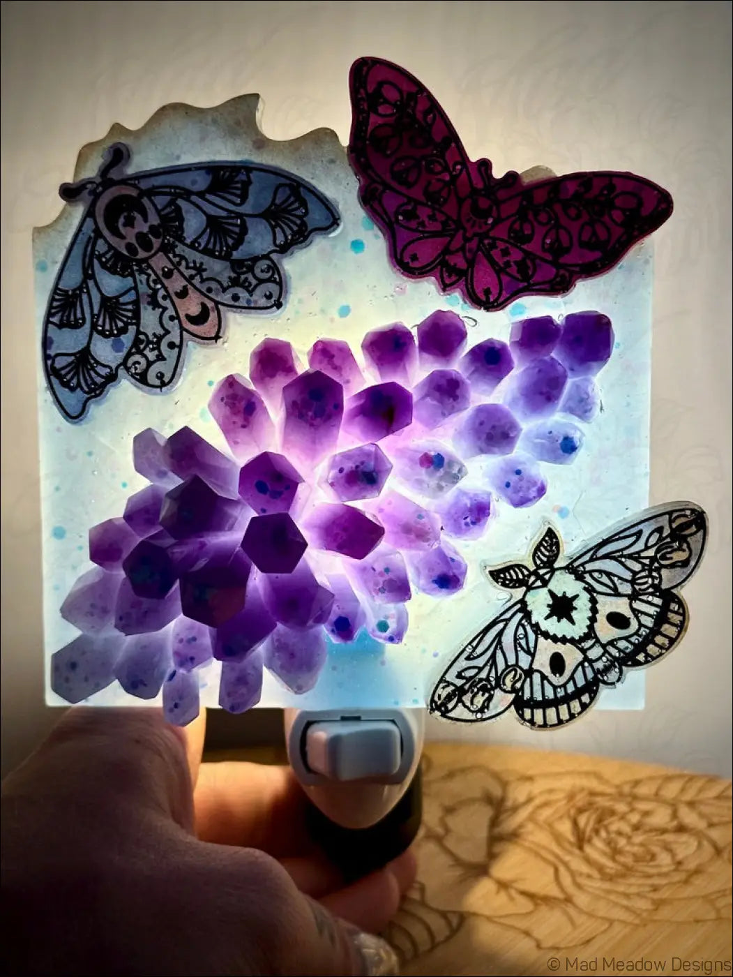 Moths and crystal cluster wall night light with a glowing purple and soft aqua blue mesmerizing crystal cluster and delicate iridescent moths
