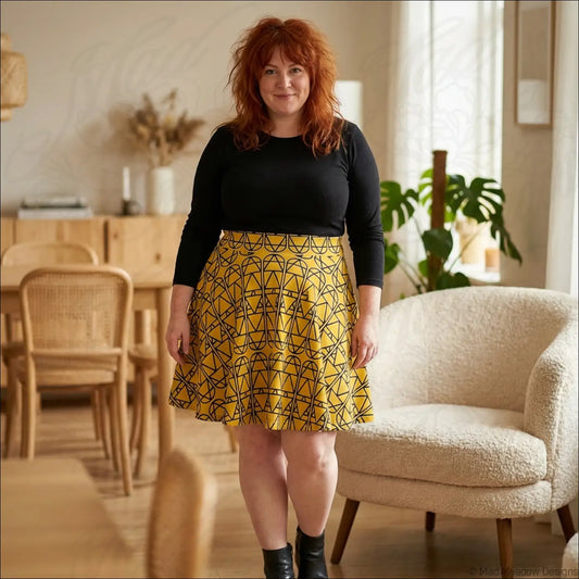 Mustard elemental column pattern women’s skater skirt with yellow geometric print and black lines, line dry care instructions