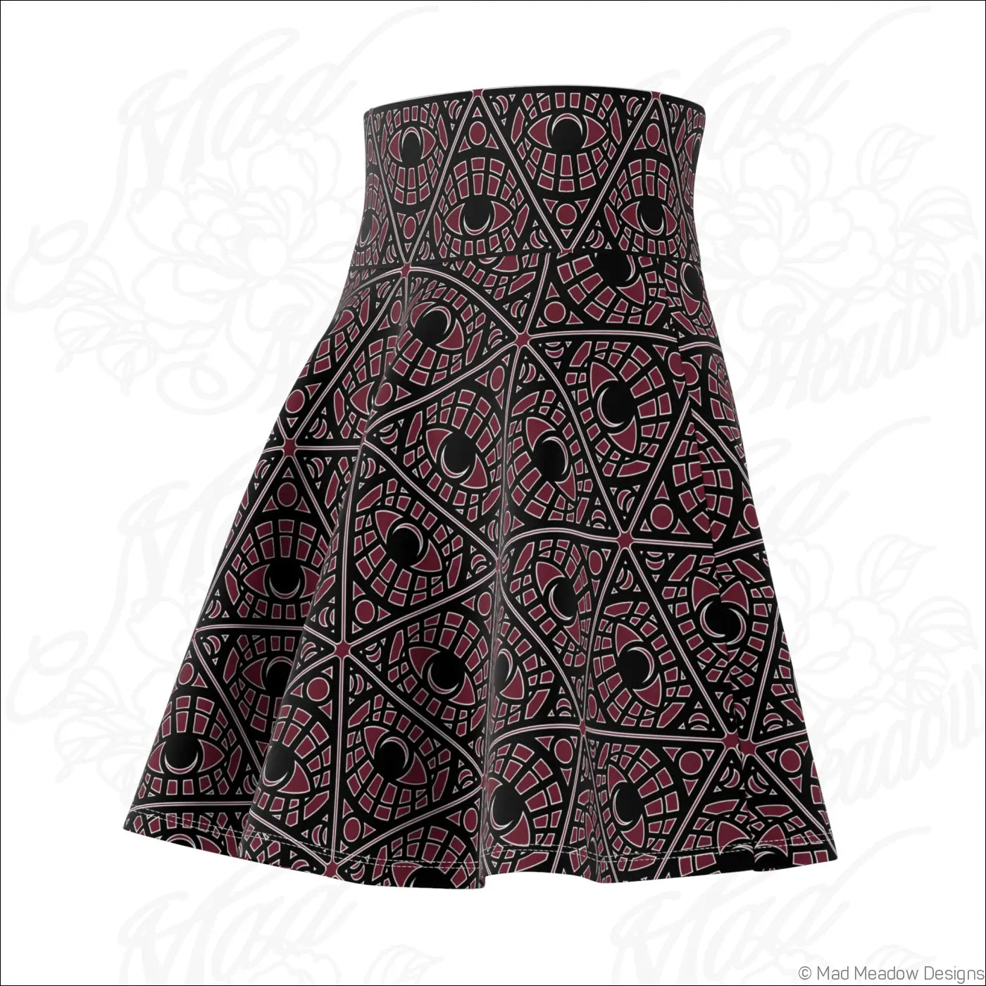 A bordeaux skater skirt with a bold geometric mystic eye print in stretch fabric and a printed care label visible