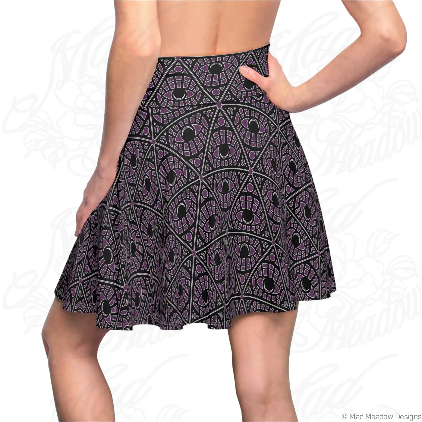 A flared eggplant skater skirt with a printed care label featuring stretch fabric and a purple geometric eye pattern