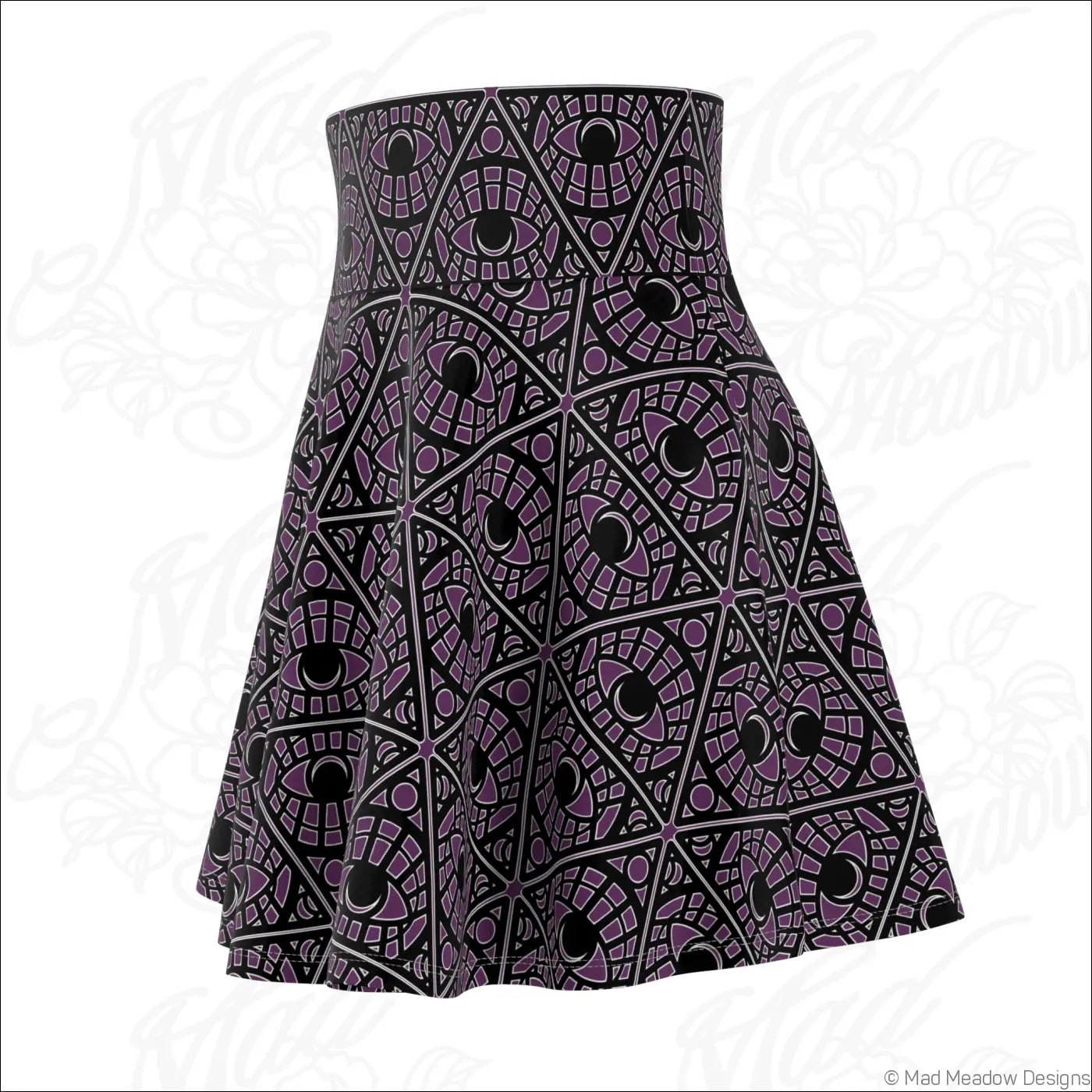 A flared eggplant skater skirt with bold purple and black geometric eyes print on stretch fabric with printed care label