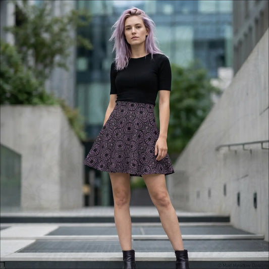 Mystic eye tribal pattern skater skirt in stretch fabric featuring a black and purple geometric eggplant print and printed care label