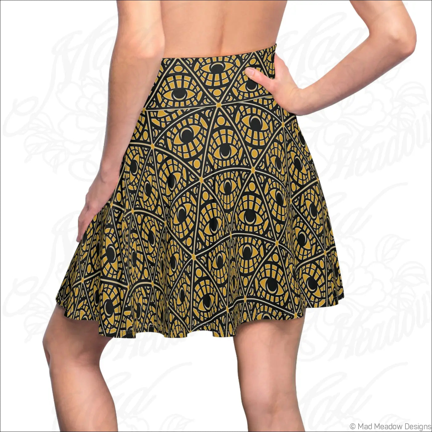 Mystic eye tribal pattern skater skirt with bold gold and black eye print on stretch fabric with printed care label