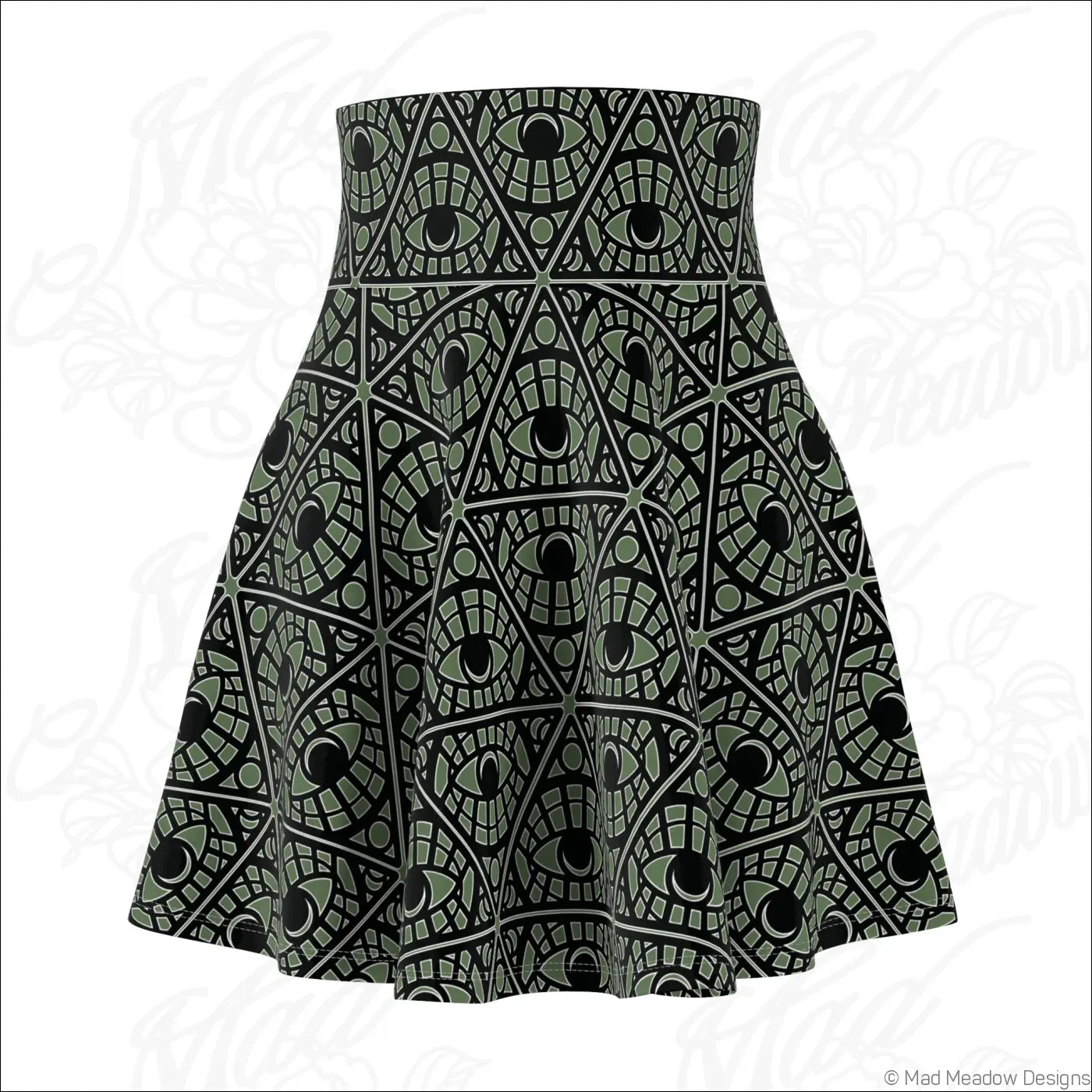A sage skater skirt with a bold olive green and black mystic eye tribal pattern on stretch fabric with printed care label