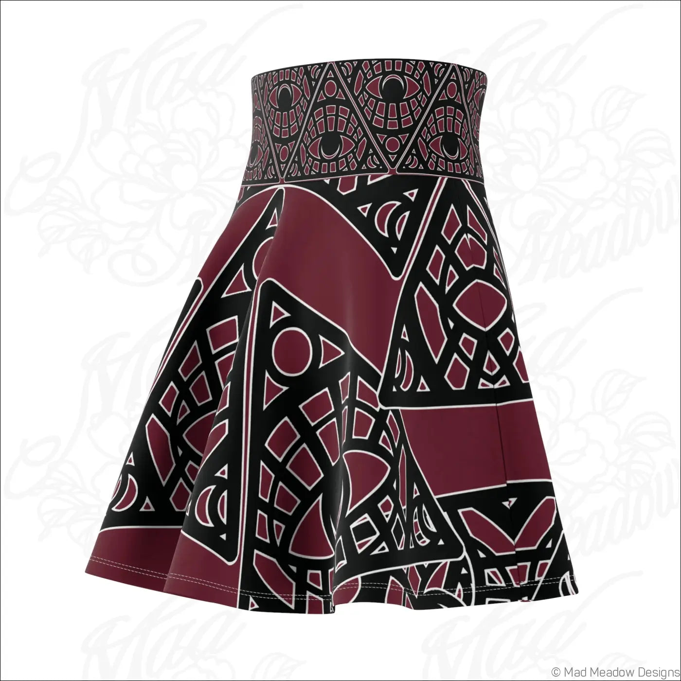 A maroon and black mystic eye tribal skater skirt with stretch fabric and printed care label details