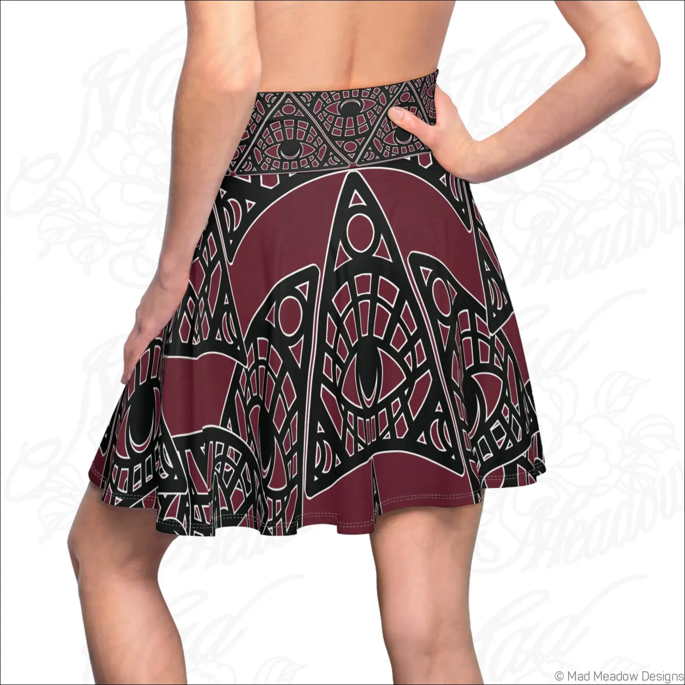 Mystic eye tribal skater skirt in bordeaux with intricate geometric eye print made of stretchy fabric with printed care label