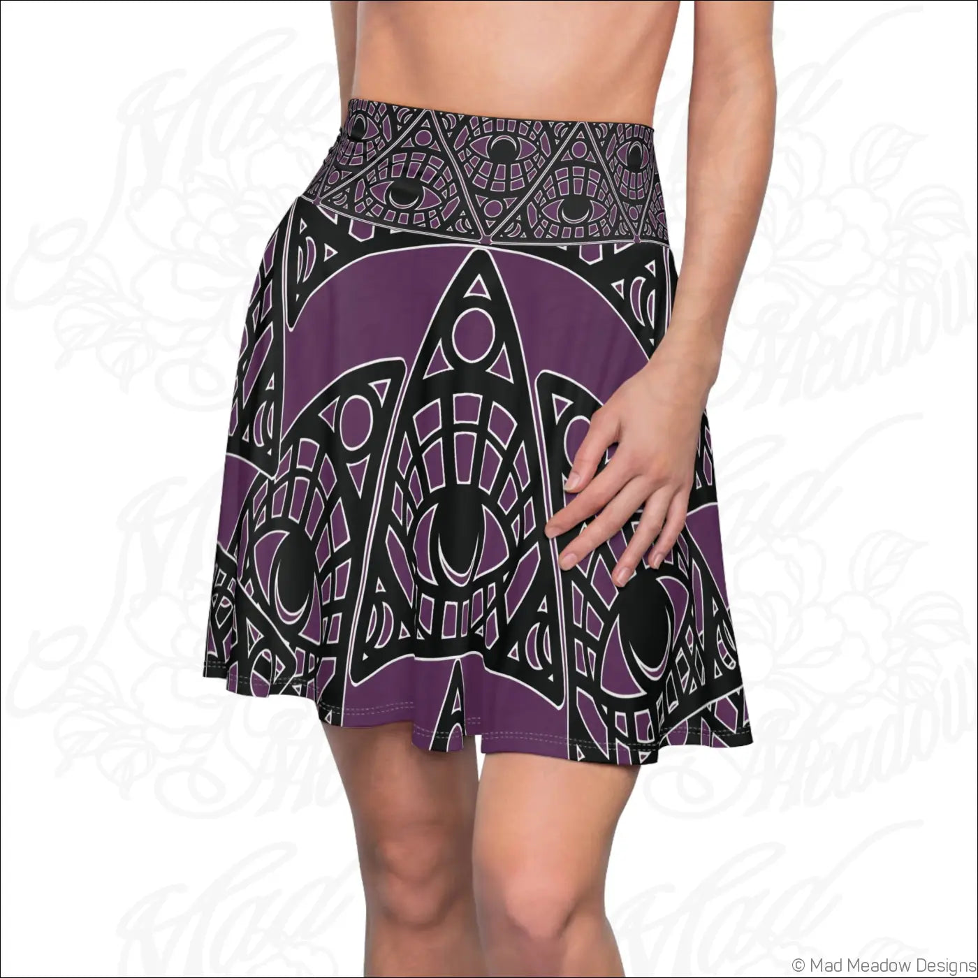 Purple and black mystic eye tribal skater skirt with stretch fabric and printed care label in eggplant allover print