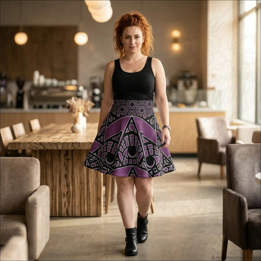 A woman wears a black and purple mystic eye tribal skater skirt with stretch fabric and printed care label visible