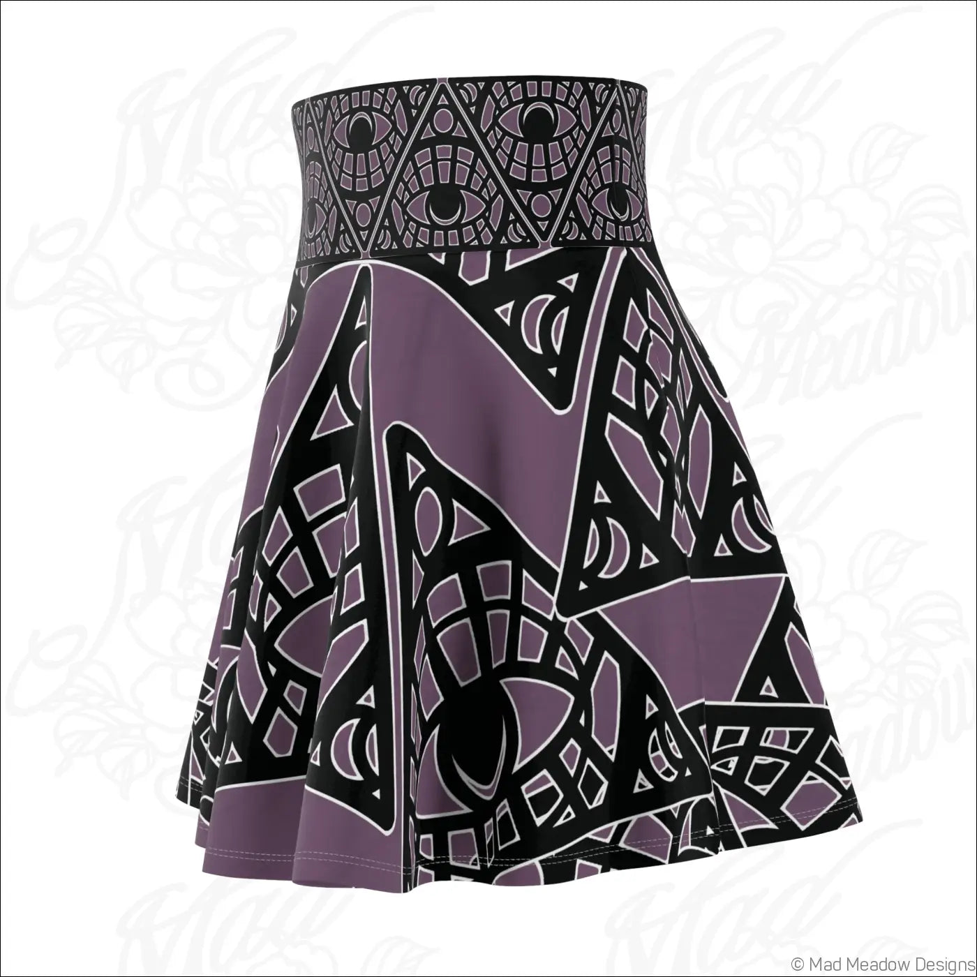 A purple and black tribal skater skirt with mystic eye tribal print and a printed care label detail