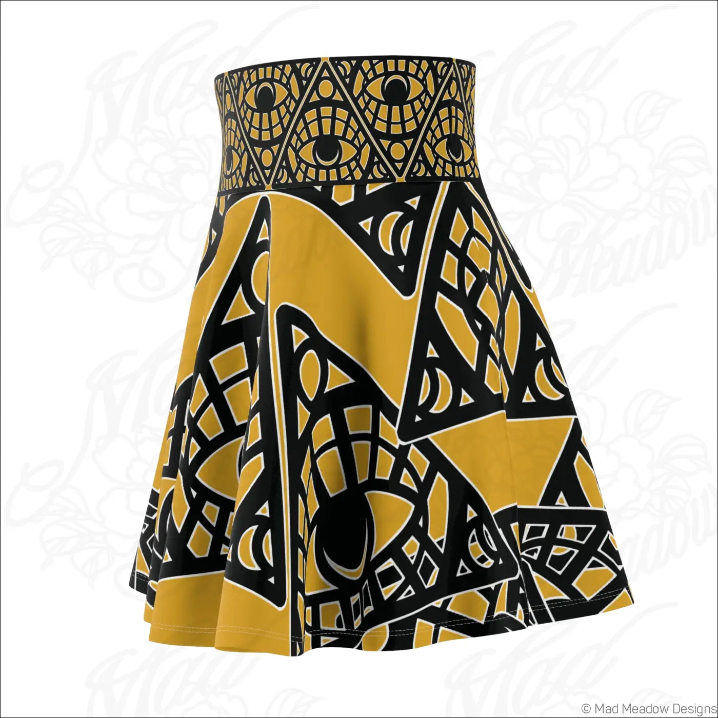 A vibrant yellow and black mystic eye tribal skater skirt with bold geometric eye motifs and printed care label visible