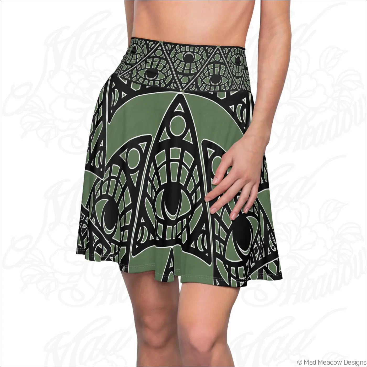 Olive green and black skater skirt with mystic eye tribal print stretch fabric and printed care label visible