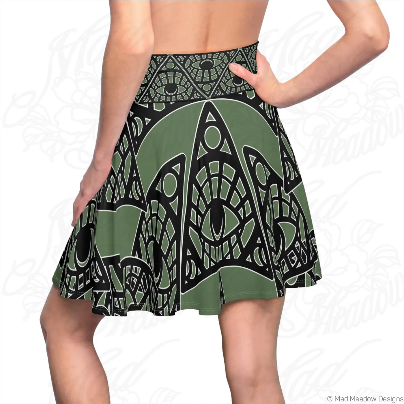 Olive green and black geometric eye-patterned skater skirt with stretch fabric and printed care label in sage print