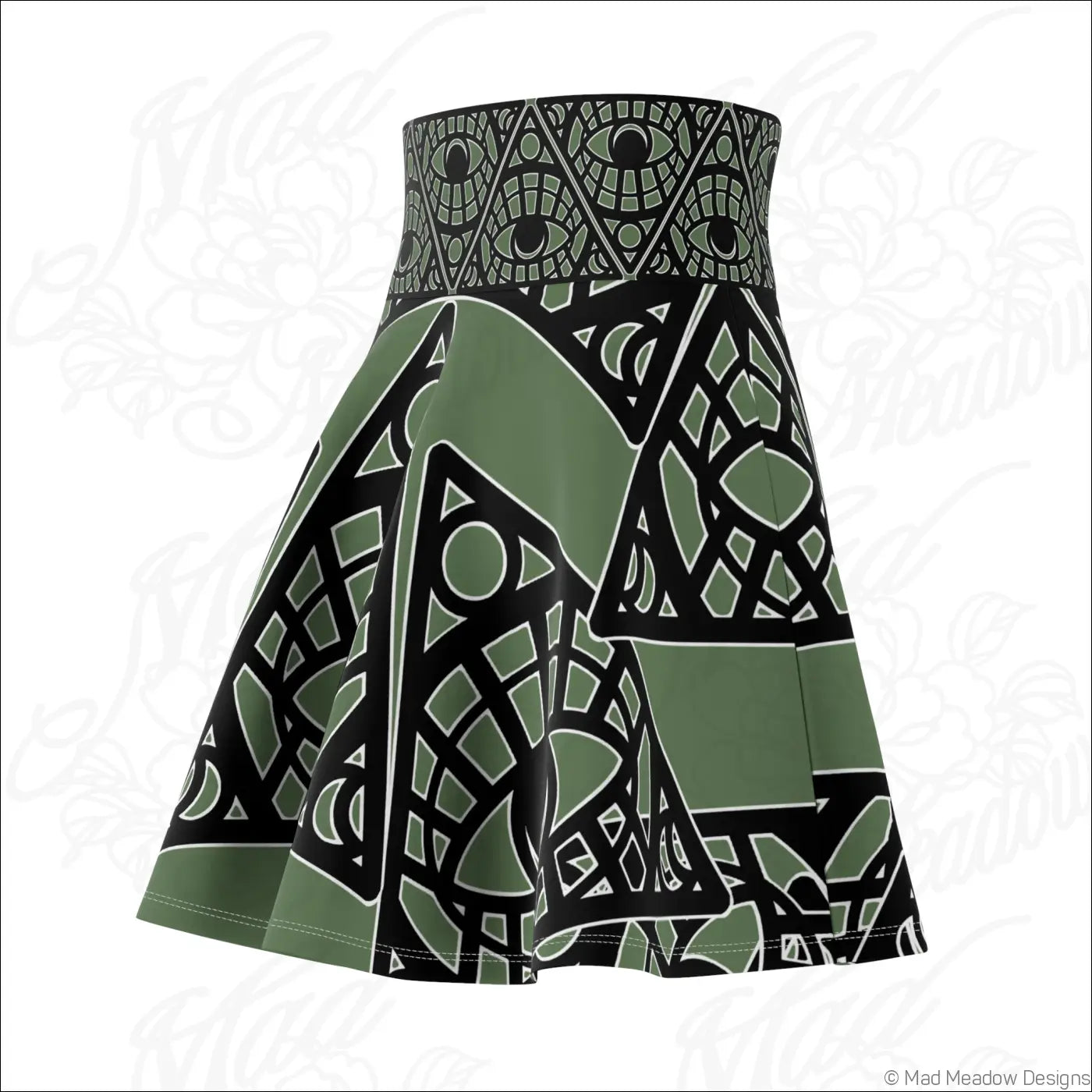 Olive green and black geometric patterned skater skirt with eye motifs and stretch fabric featuring printed care label