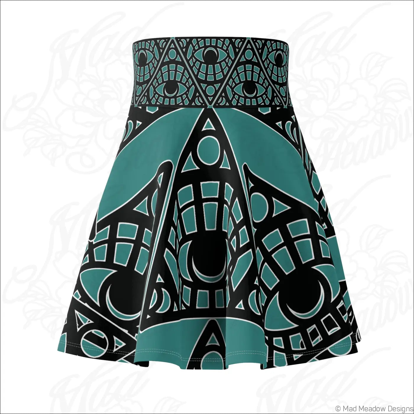 A teal and black tribal skater skirt with mystic eye print and a printed care label in geometric patterns
