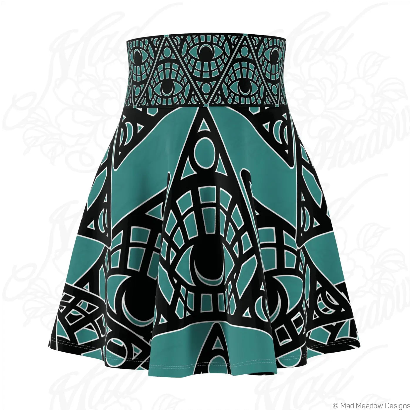 Teal and black tribal skater skirt with mystic eye geometric print and printed care label visible on the back side
