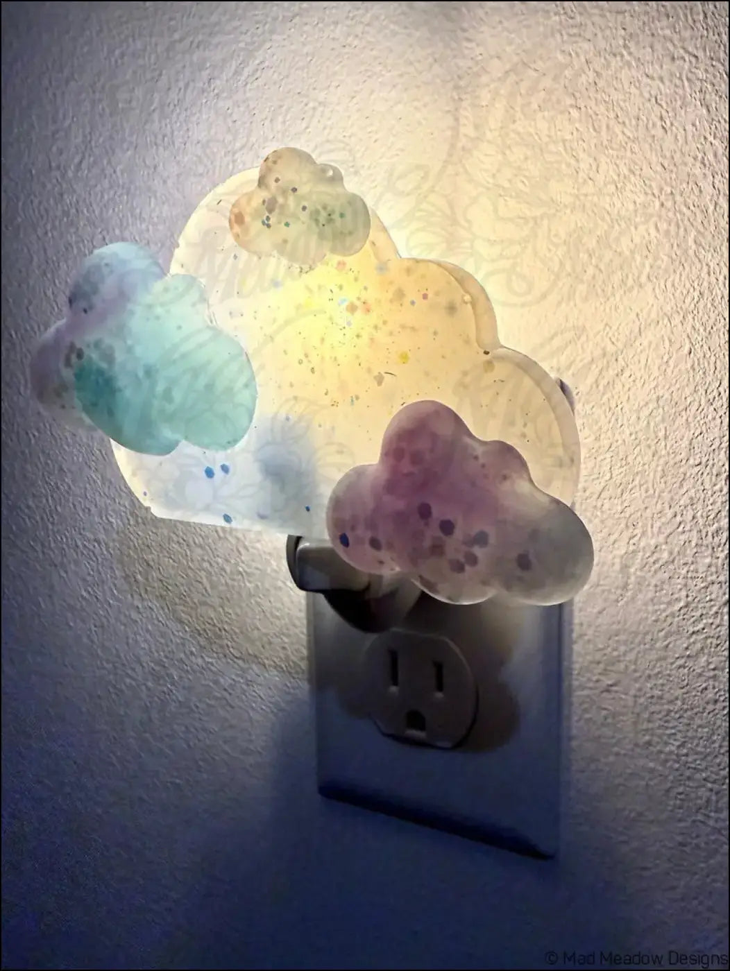 Pastel blue and purple clouds wall night light with translucent glitter rainbow cloud design by mad meadow designs plug-in base