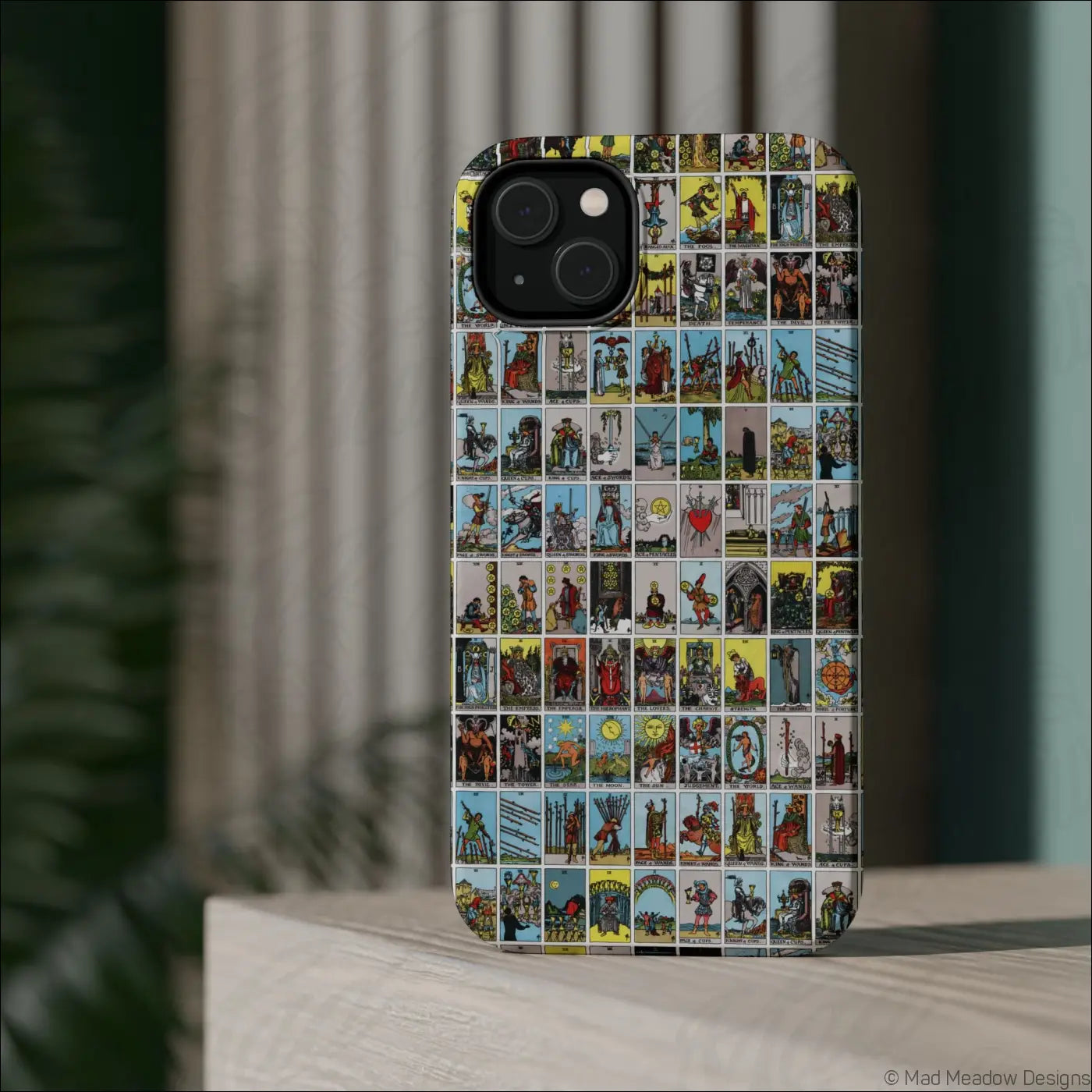 Back view of a phone case with vibrant vintage tarot card collage design made from rigid polycarbonate shell
