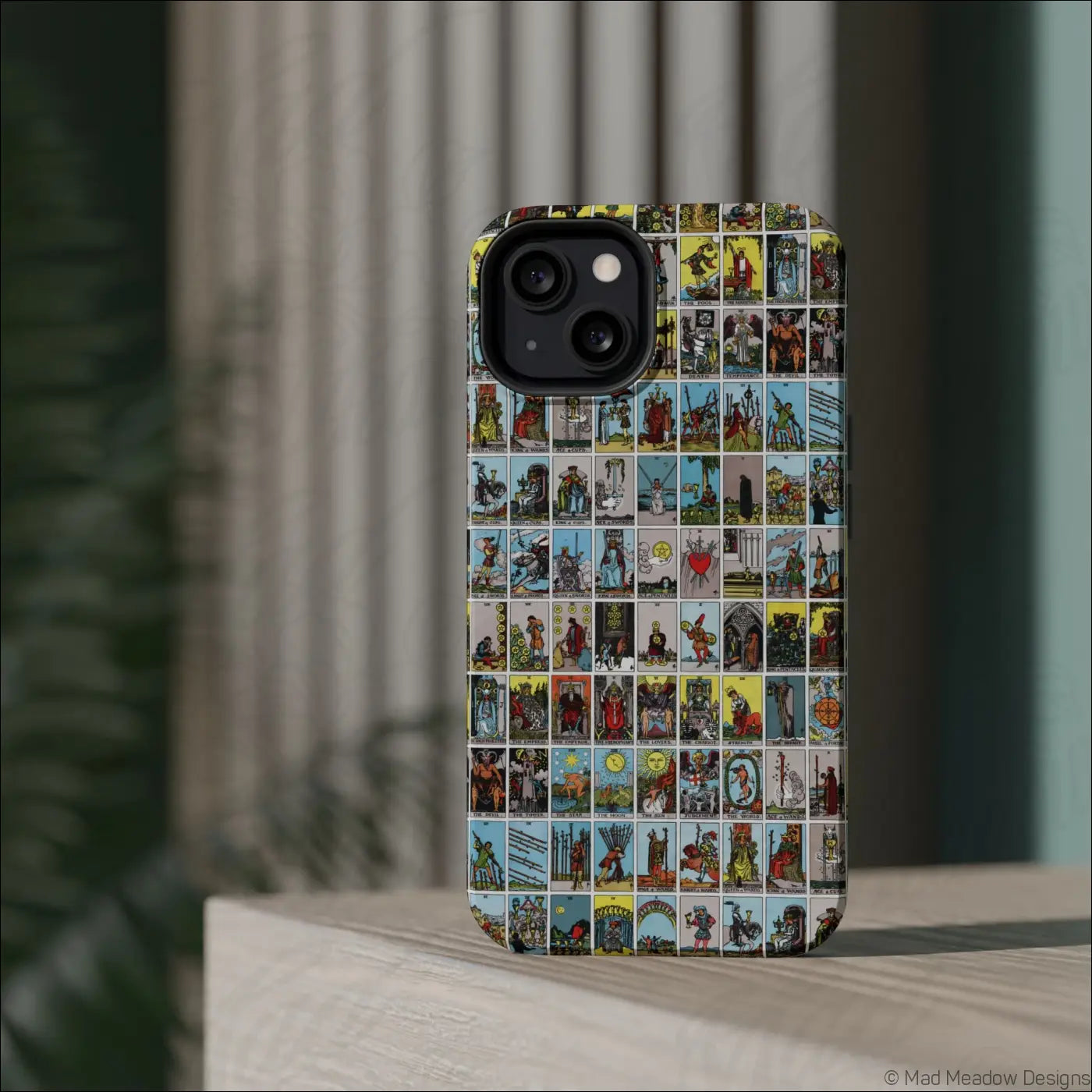 Back of phone case with vibrant vintage tarot card collage design on rigid polycarbonate shell for impact resistance