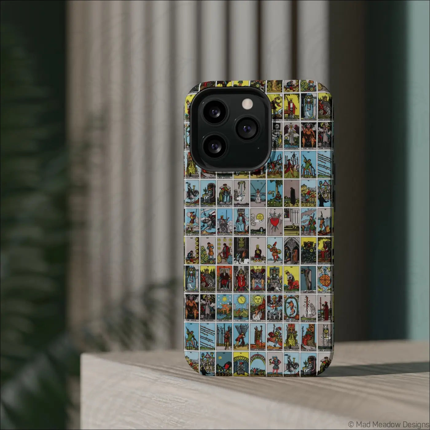 Vibrant phone case with vintage tarot card collage design on rigid polycarbonate shell for impact resistance