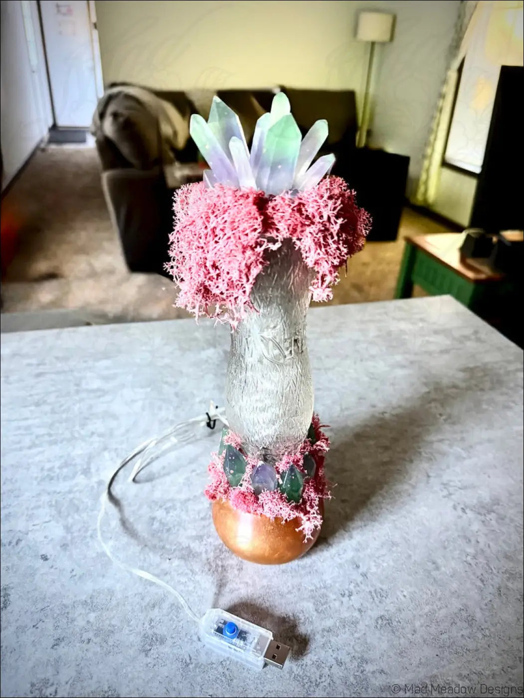Decorative illuminated crystal lamp with pink moss green crystals in a whistle soda vintage 1920s hourglass whistle bottle