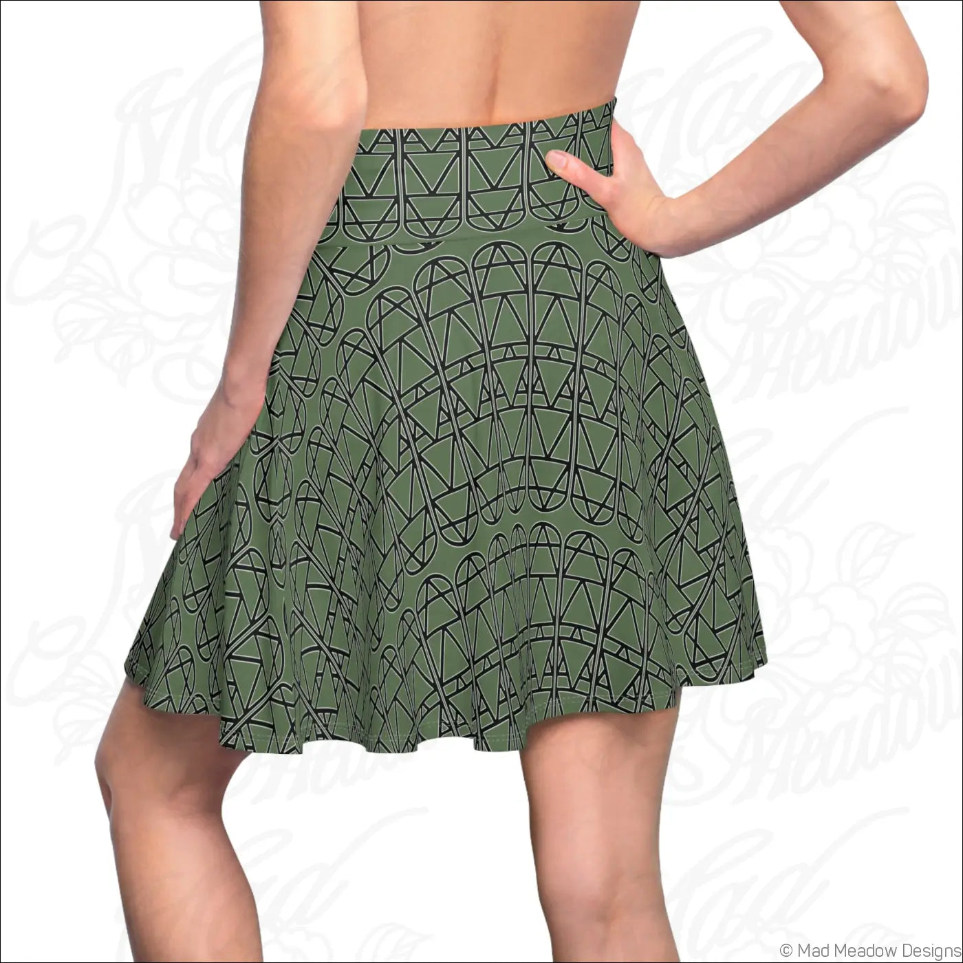 Olive green skater skirt with black elemental column pattern featuring care instructions for hand wash only