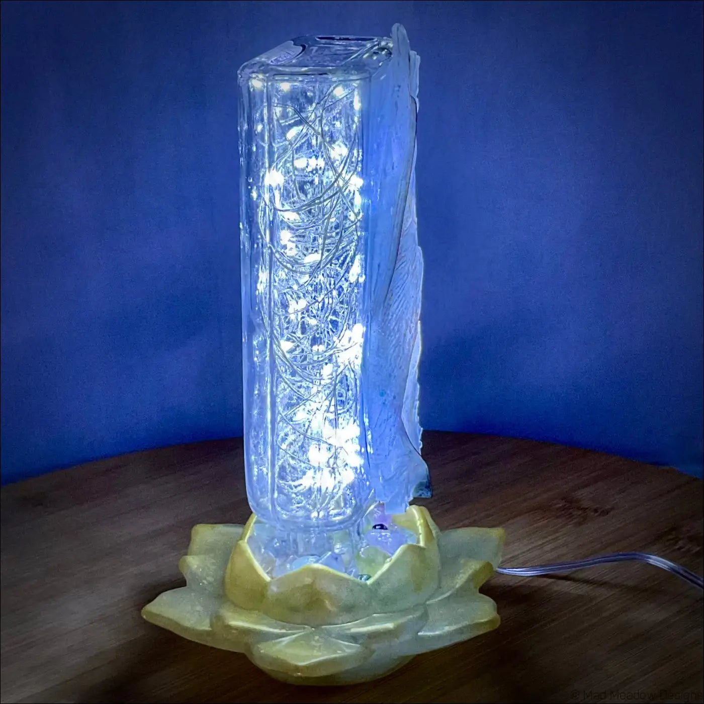 Clear glass antique glass apothecary bottle with intricate led lights on yellow lotus base usb light
