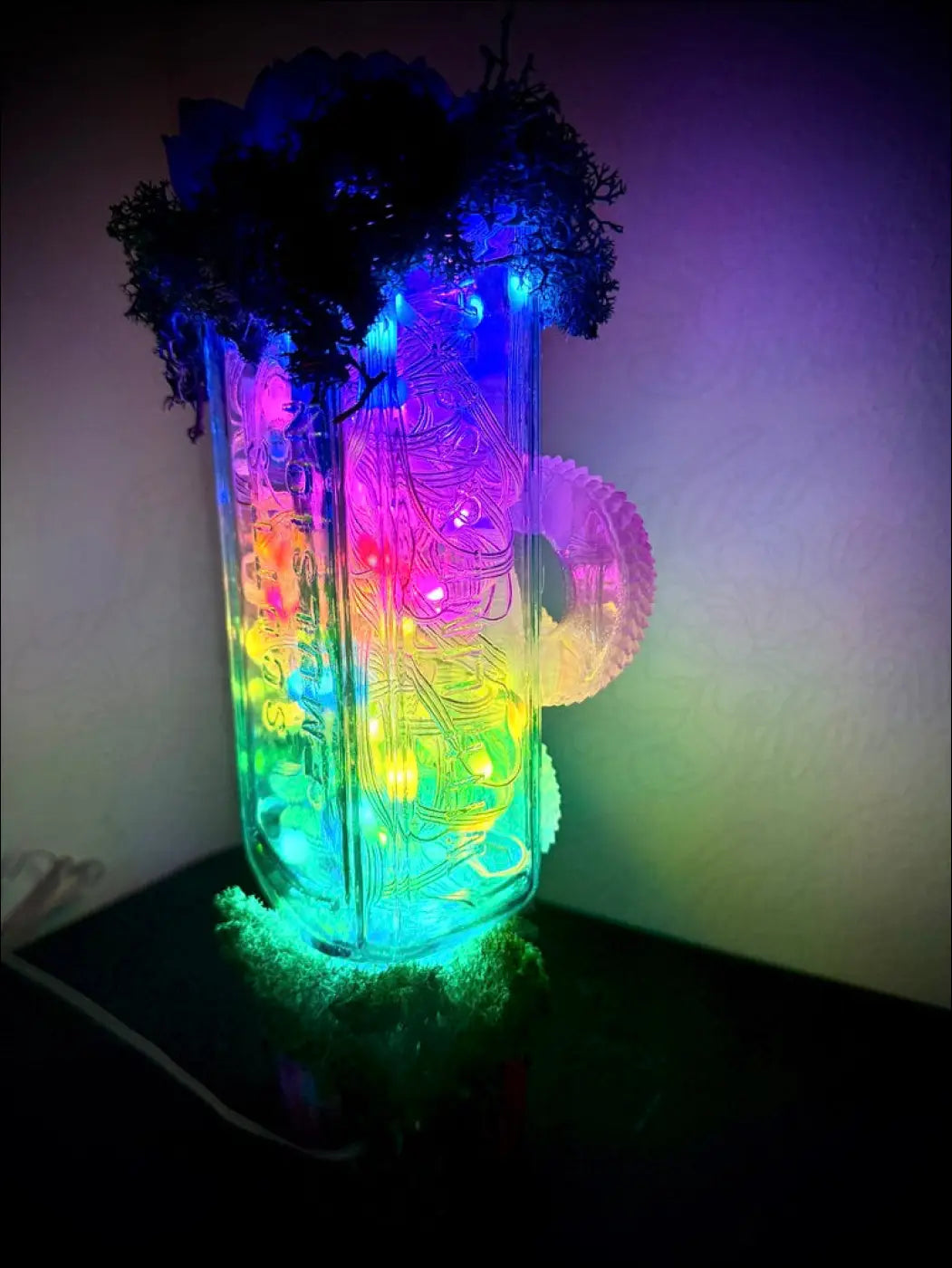 Colorful illuminated antique glass apothecary bottle usb lamp with led rainbow glow topped with dark green moss and crystals