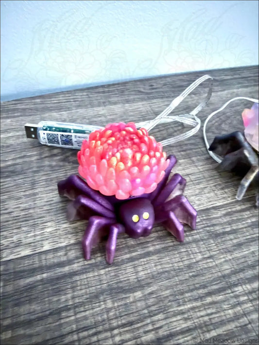 Purple spider flower light usb charging station with pink textured top and yellow eyes app controlled device