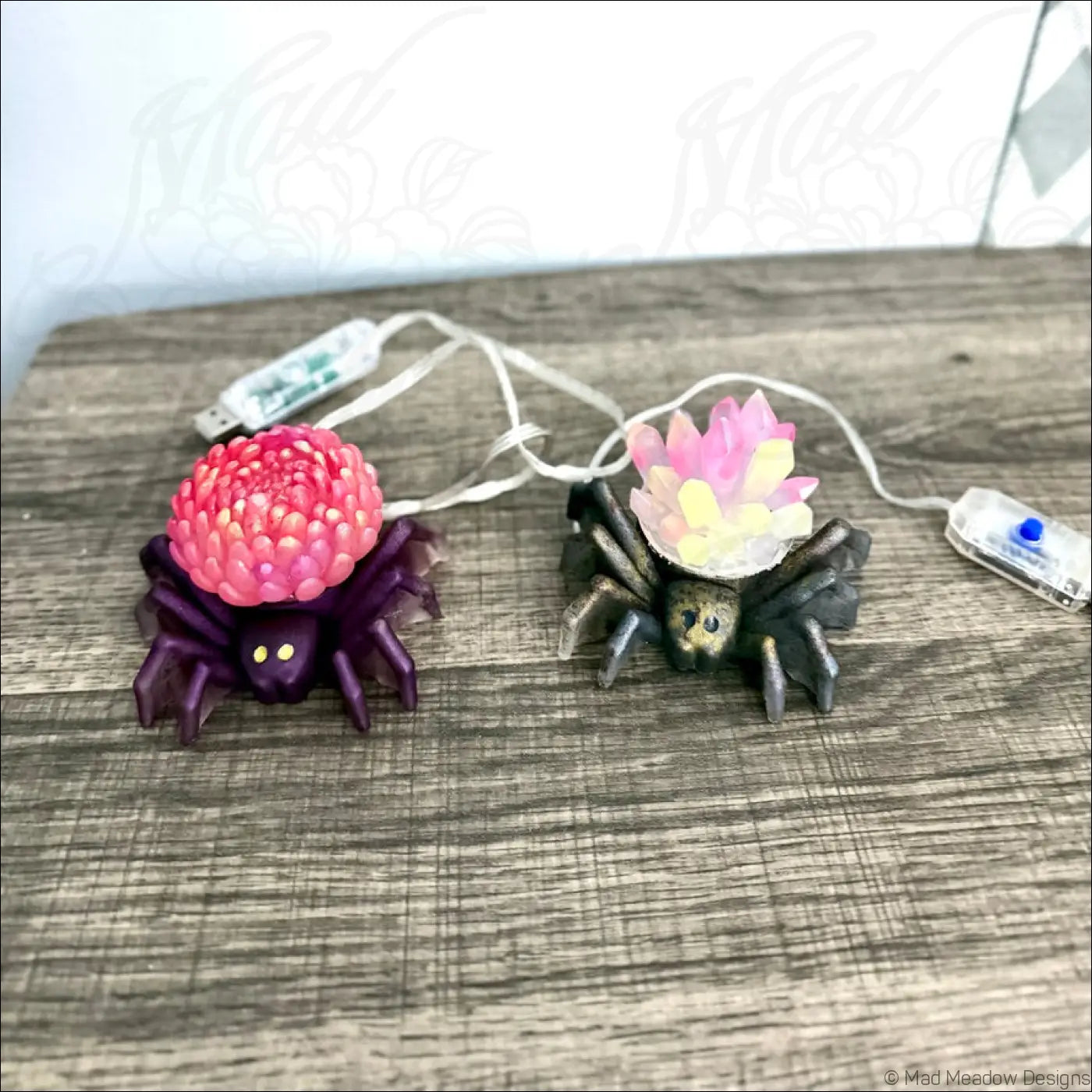 Two spider flower light usb app controlled led ornaments with vibrant pink and pastel floral designs