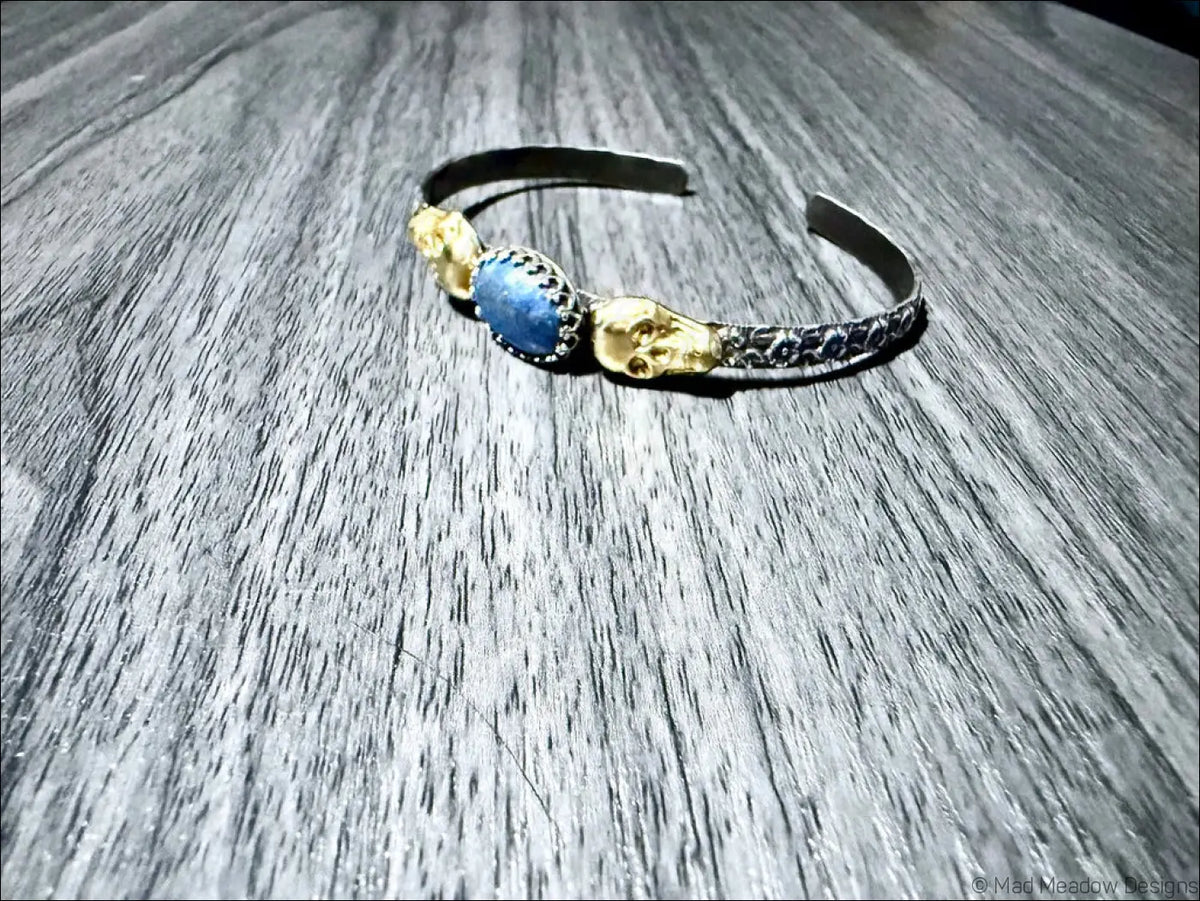 Sterling Silver Cuff Bracelet with Brass Skulls and Lapis Lazuli Stone - Bracelet