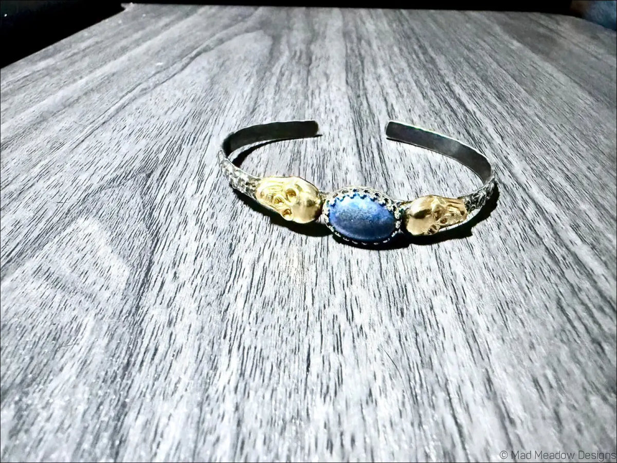 Sterling Silver Cuff Bracelet with Brass Skulls and Lapis Lazuli Stone - Bracelet