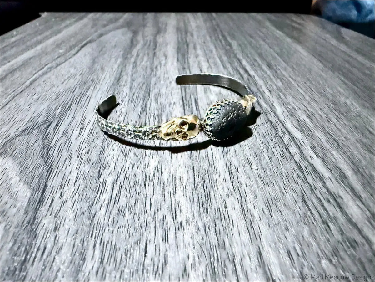 Sterling Silver Cuff Bracelet with Brass Skulls and Lava Stone - Bracelet