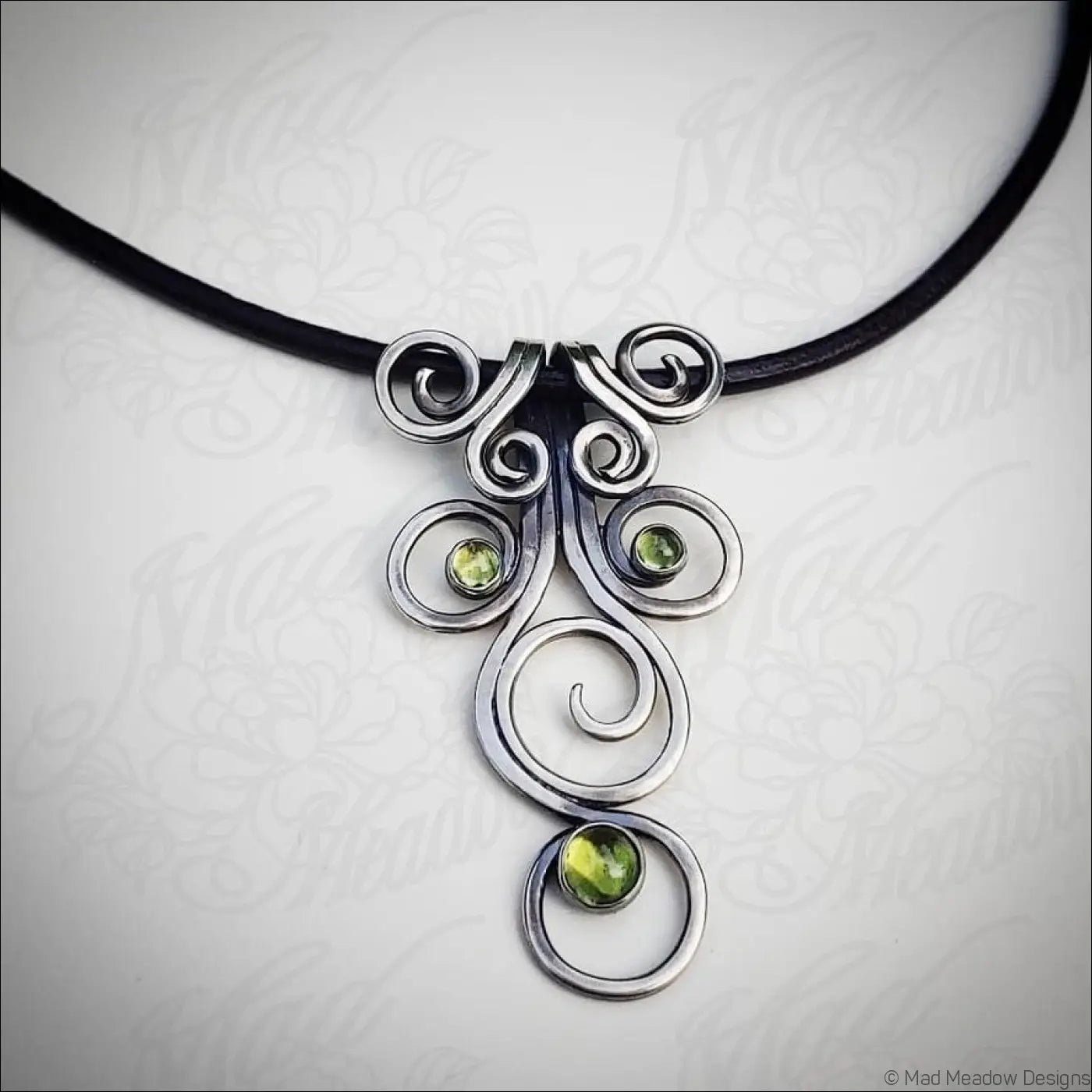 Sterling Silver Fiddlehead Swirl Necklace with Green Peridot Gemstones
