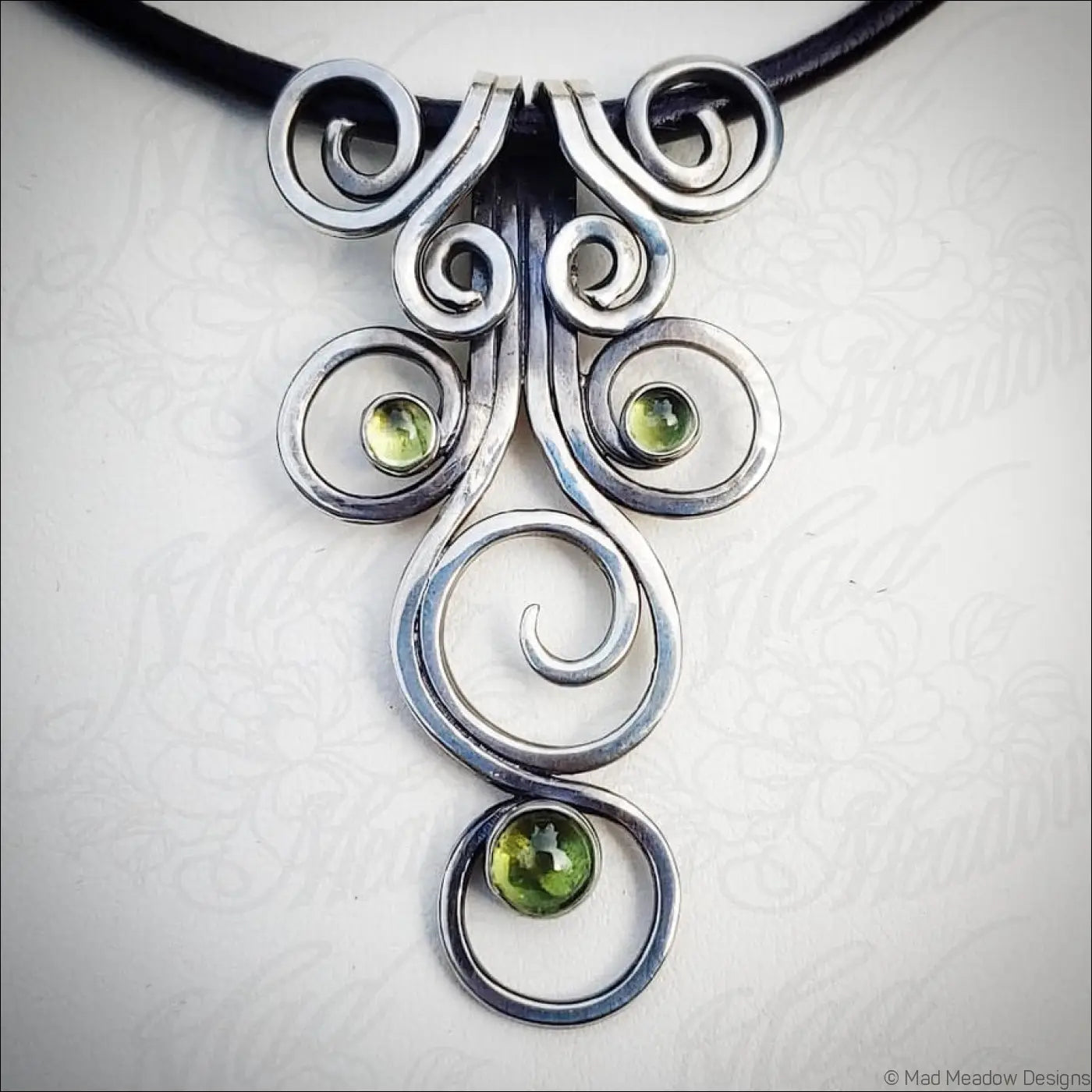 Sterling Silver Fiddlehead Swirl Necklace with Green Peridot Gemstones