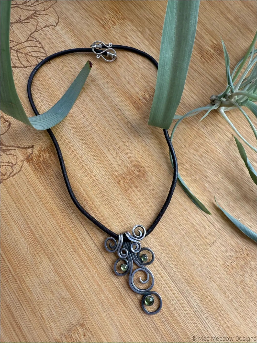Sterling Silver Fiddlehead Swirl Necklace with Green Peridot Gemstones