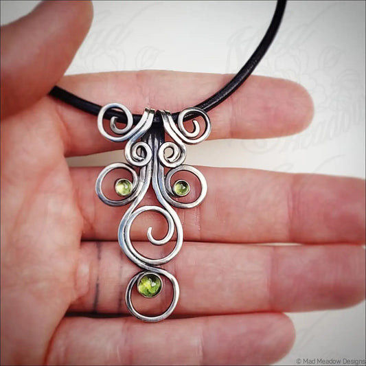 Sterling Silver Fiddlehead Swirl Necklace with Green Peridot Gemstones