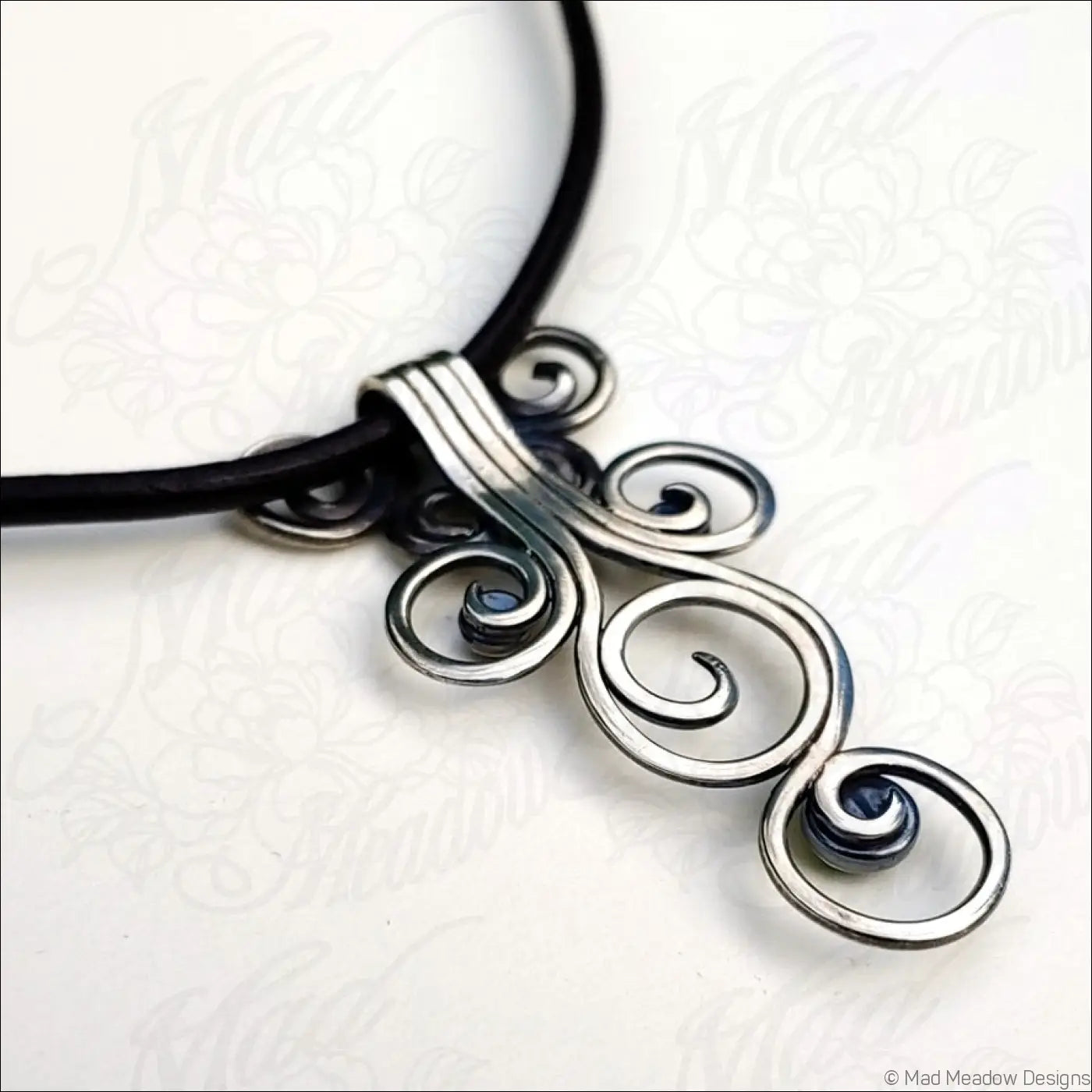 Sterling Silver Fiddlehead Swirl Necklace with Green Peridot Gemstones