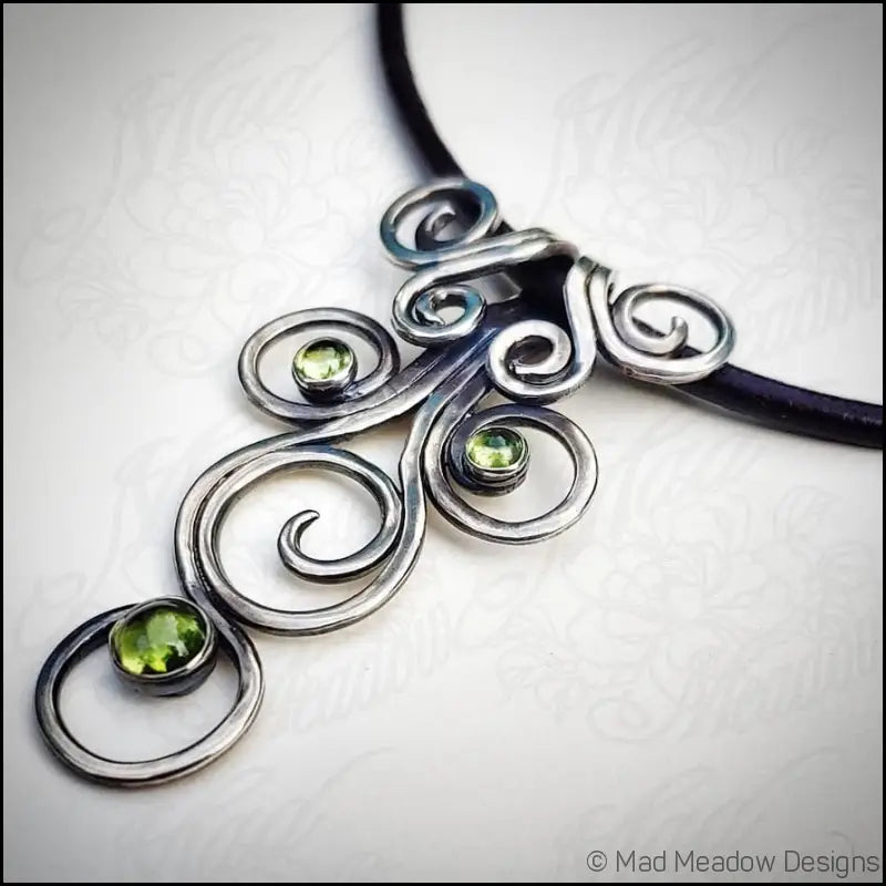 Fiddlehead Sterling Silver and Peridot Artisan Made Pendant on Leather - Jewelry