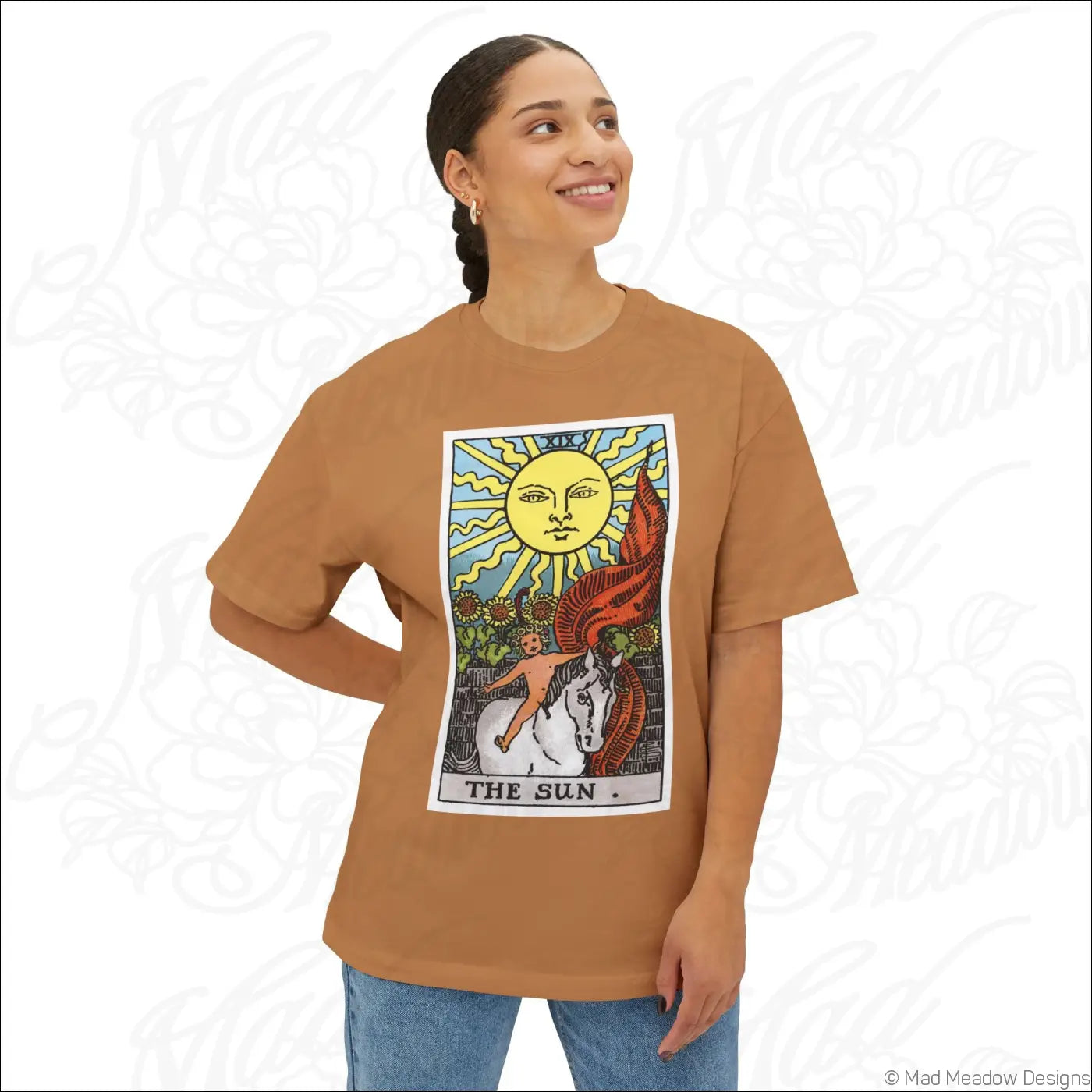 A tan cotton oversized boxy tee with a colorful sun tarot card graphic perfect for low heat washing