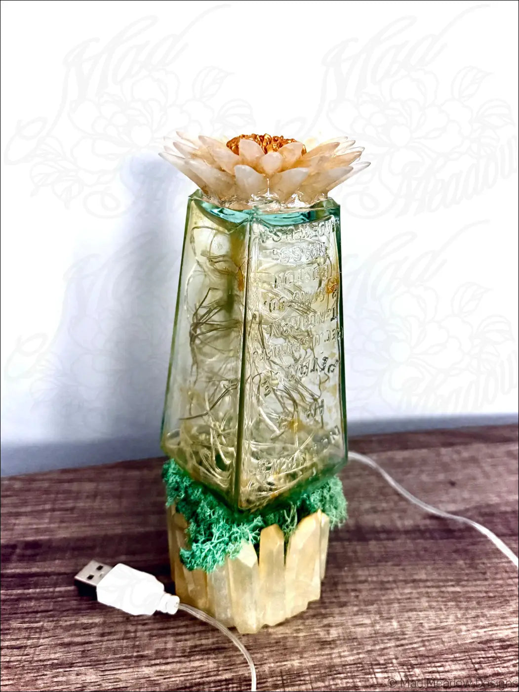 Translucent green glass hair petrole bottle lamp with white gold flower and fairy lights inside for cozy decor