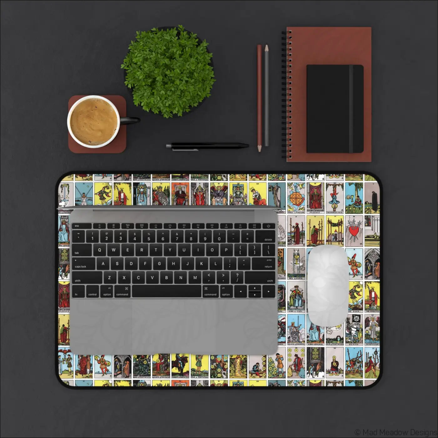 Rectangular desk mat featuring vibrant vintage lotería-style tarot card illustrations with care instructions for warm water cleaning