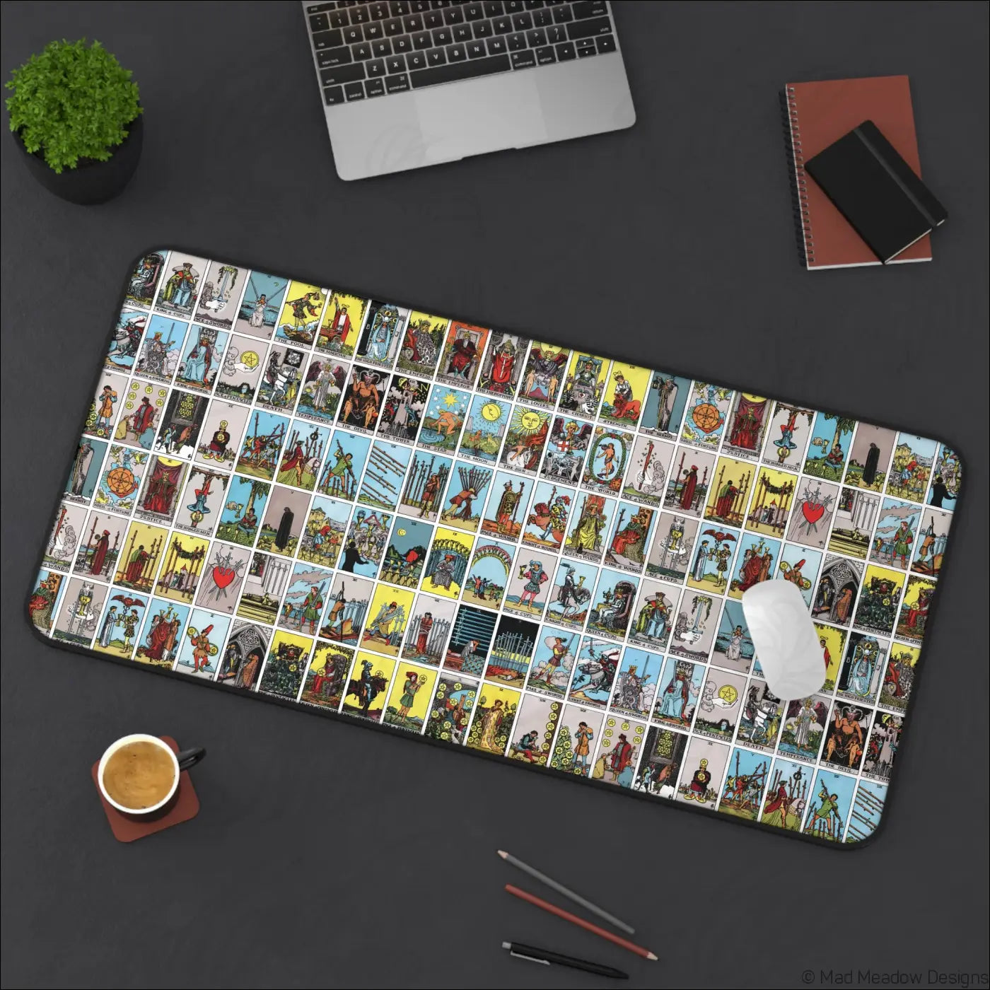 Rectangular black-bordered desk mat with vibrant vintage lotería-style tarot card grid and care instructions for warm water use