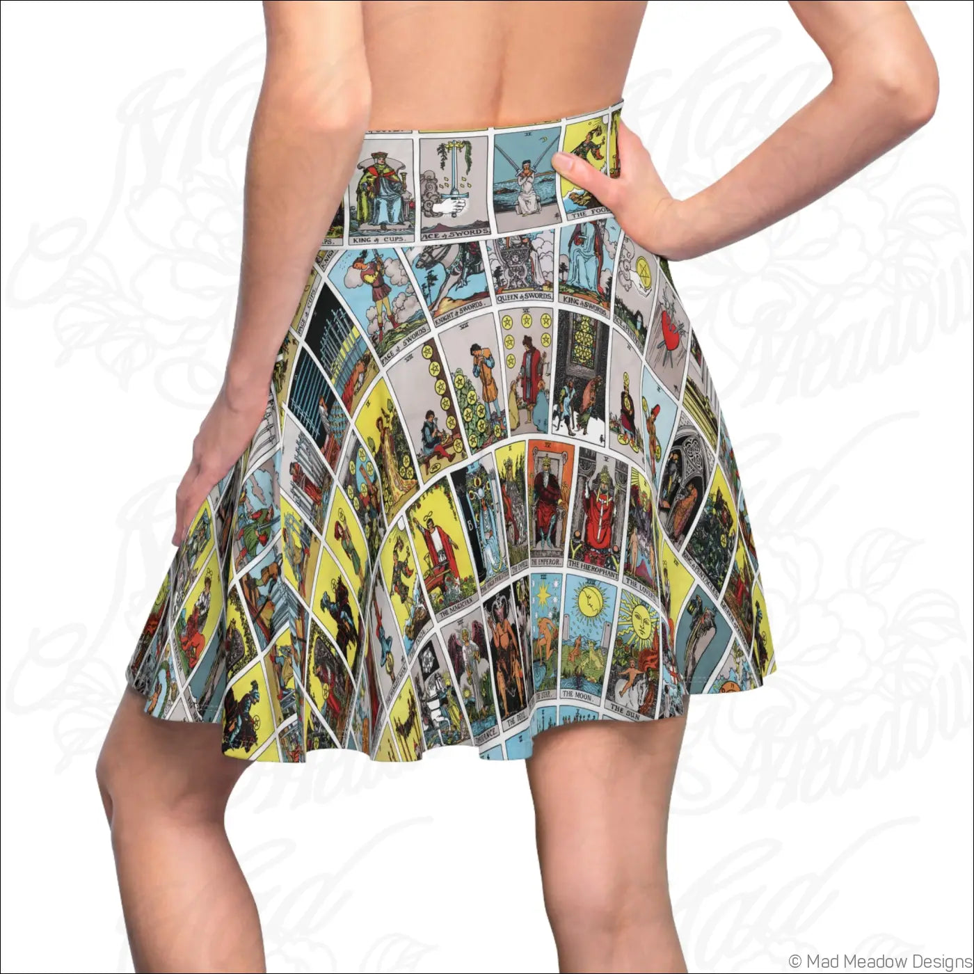 A vibrant flared skater skirt with colorful tarot card print in mystical astrology style and care instructions to hand wash