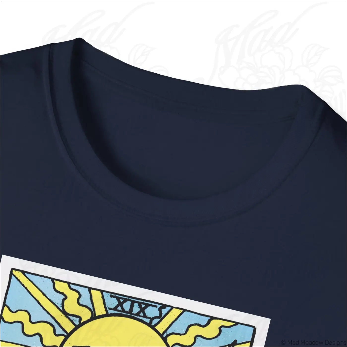 Navy blue cotton sun tarot card t-shirt with vibrant yellow rays on light blue background made from ethically sourced cotton