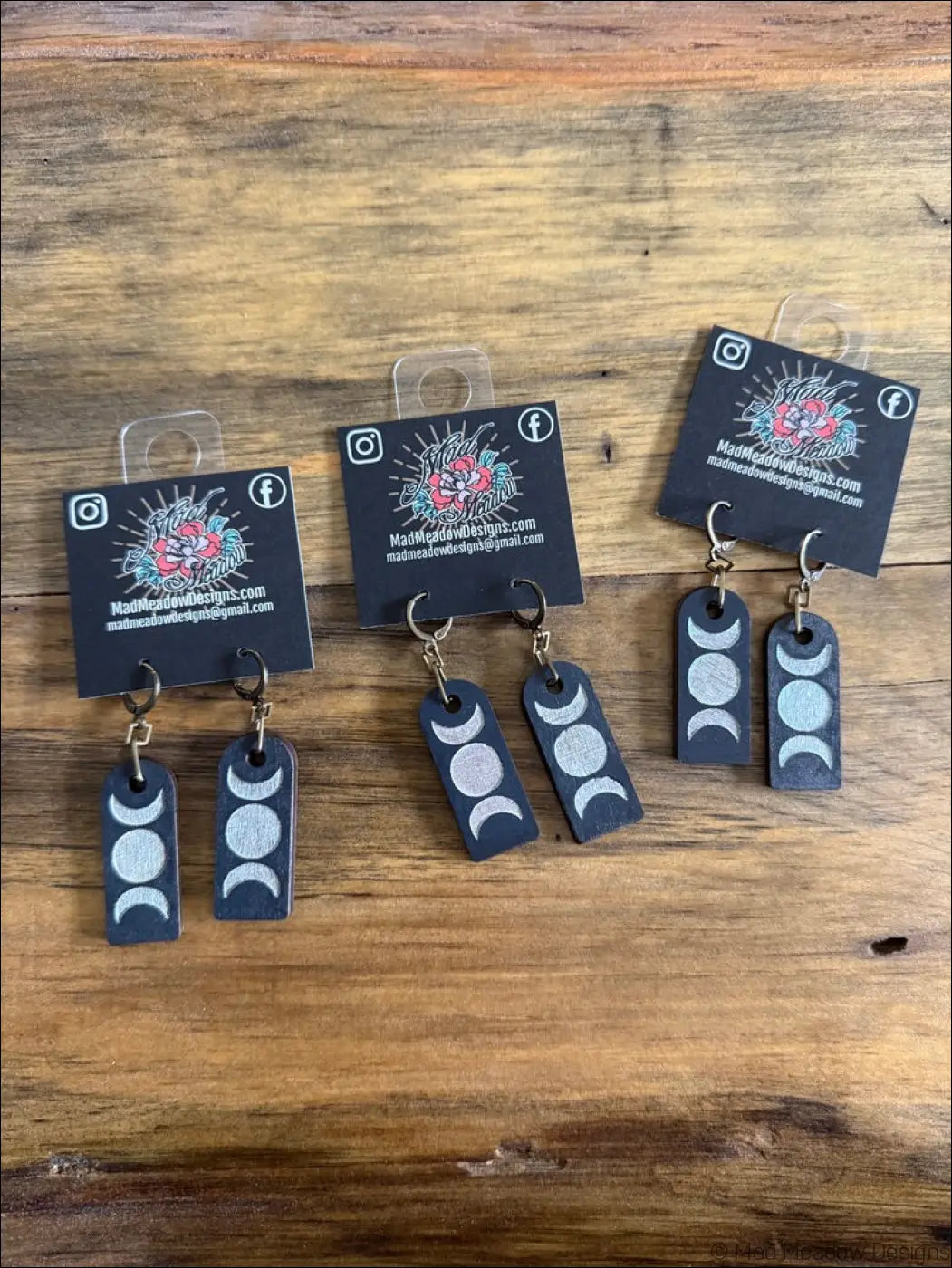Black rectangular wooden earrings with silver triple moon hand-painted leather design